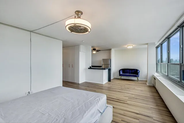 a view of a kitchen with a sink and microwave