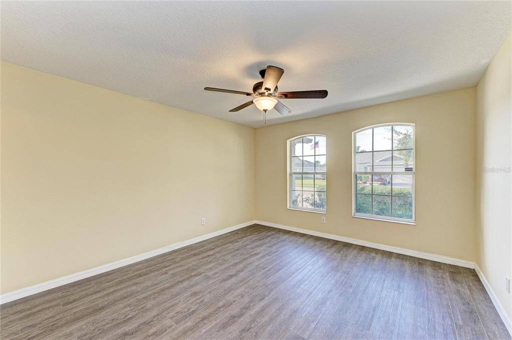 11611 Summit Rock Court Parrish, FL 34219 - Photo 40 of 54 a view of an empty room with window and wooden floor