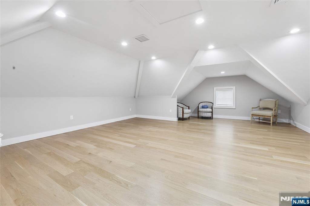 31 Engleside Street Cresskill, NJ 07626 - Photo 27 of 49 a view of a room with gym equipment and a ceiling fan