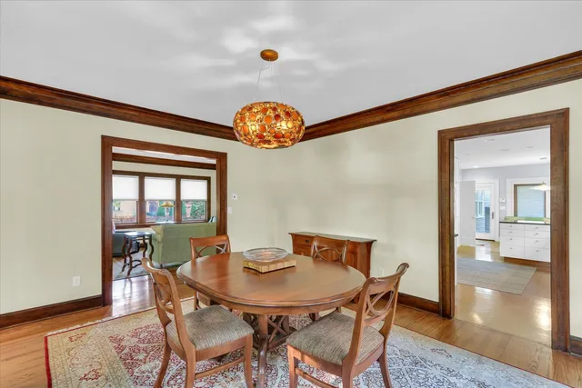 a large white kitchen with white cabinets and stainless steel appliances