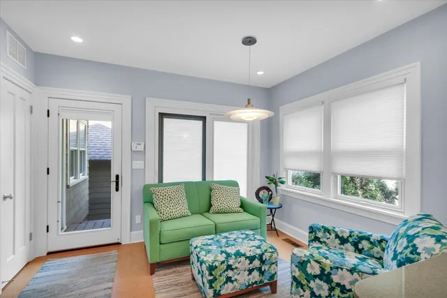 a view of a kitchen with furniture and a chandelier