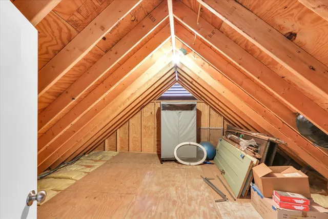 a view of a room with furniture and windows