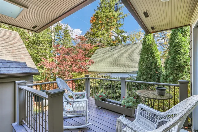 a front view of a house with garden and porch