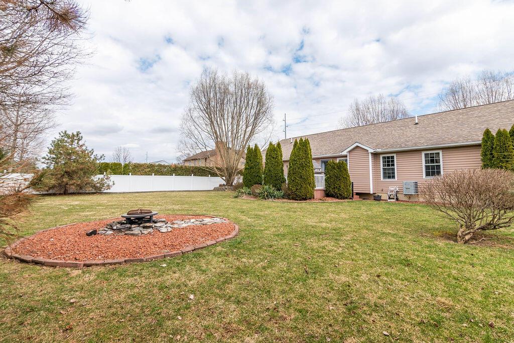 3337 Gooding Road Marion, OH 43302 - Photo 34 of 41 Back view of house with fire pit for that cook out!