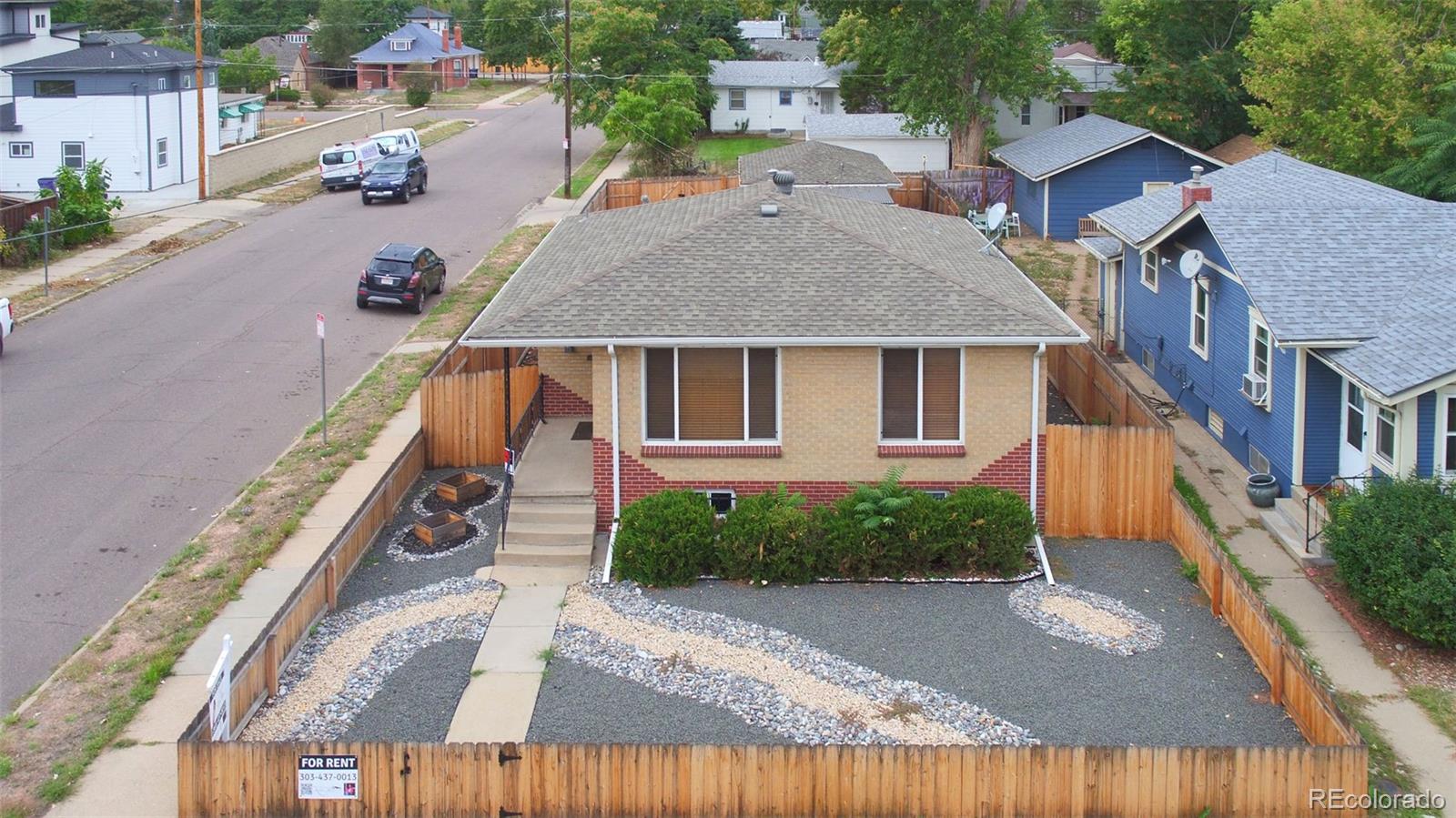 4901 Grove Street Denver, CO 80221 - Photo 24 of 25 a aerial view of a house with a yard and a garden