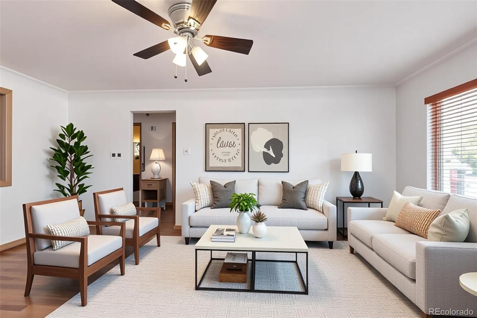 4901 Grove Street Denver, CO 80221 - Photo 6 of 25 a living room with furniture a chandelier and a potted plant