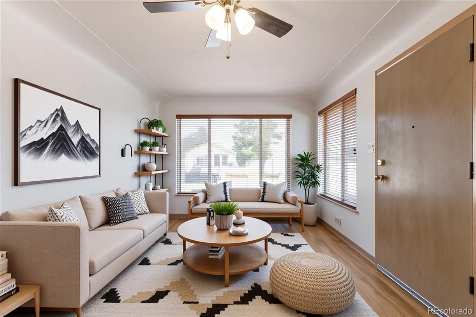 4901 Grove Street Denver, CO 80221 - Photo 7 of 25 a living room with furniture and a large window