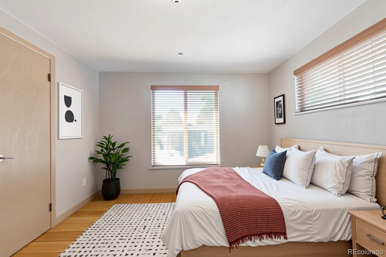 4901 Grove Street Denver, CO 80221 - Photo 9 of 25 a bedroom with a bed and a window