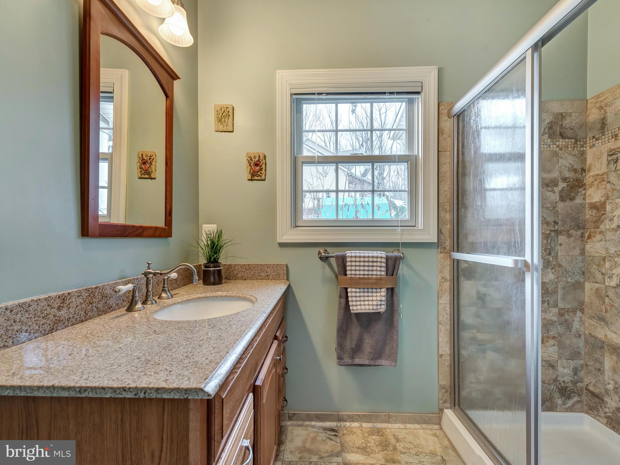 4947 Old Swimming Pool Road Frederick, MD 21703 - Photo 12 of 72 a bathroom with a granite countertop sink and a mirror