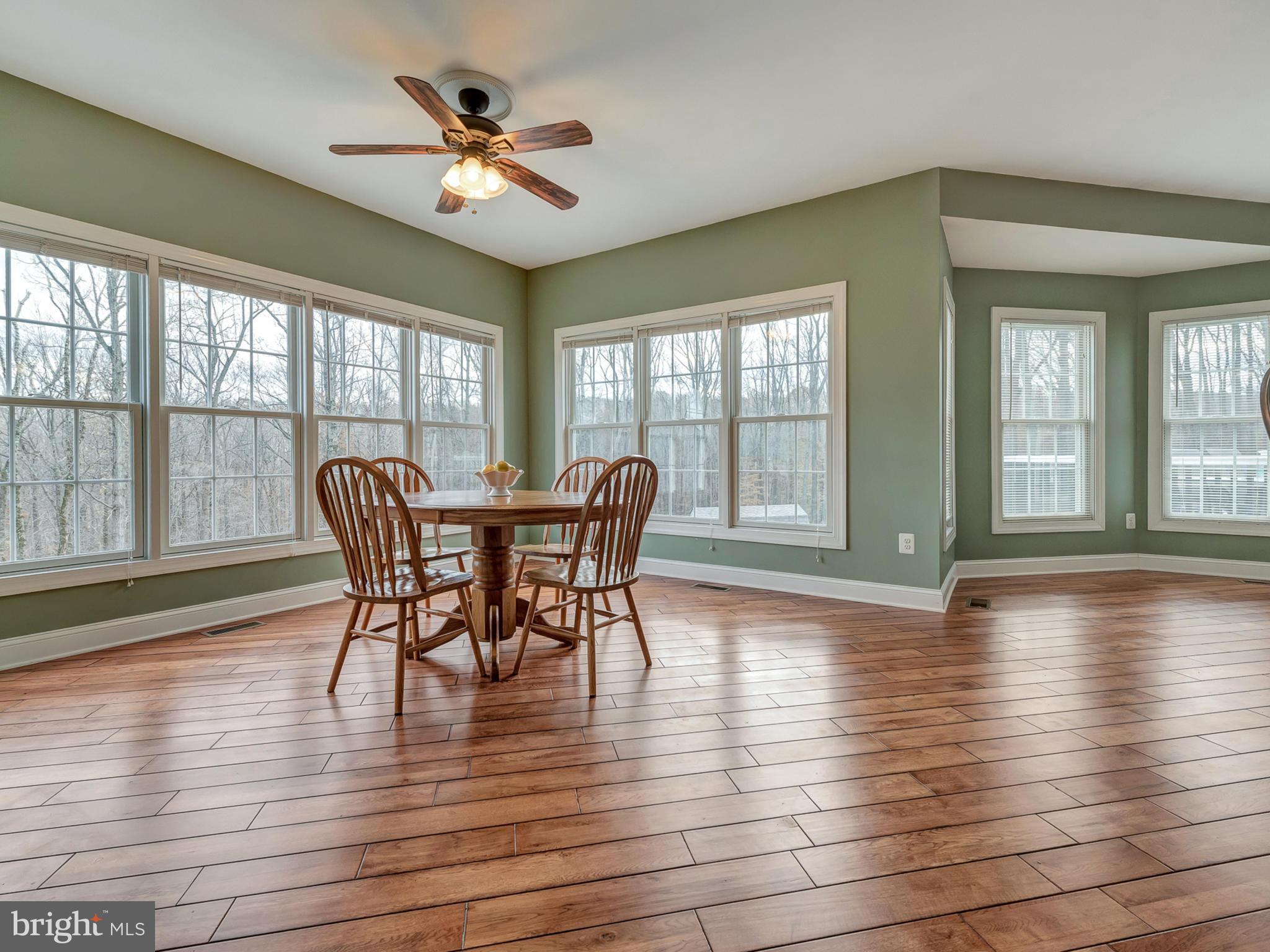 4947 Old Swimming Pool Road Frederick, MD 21703 - Photo 20 of 72 a view of a dining room with furniture window and wooden floor