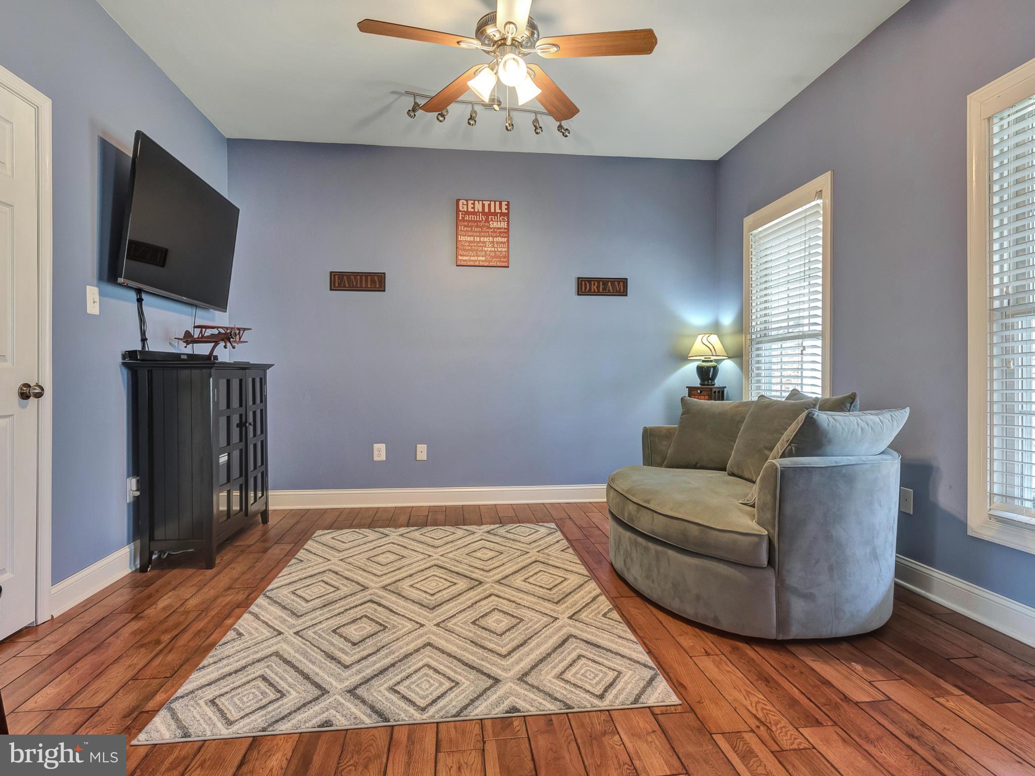 4947 Old Swimming Pool Road Frederick, MD 21703 - Photo 3 of 72 a living room with furniture and a flat screen tv