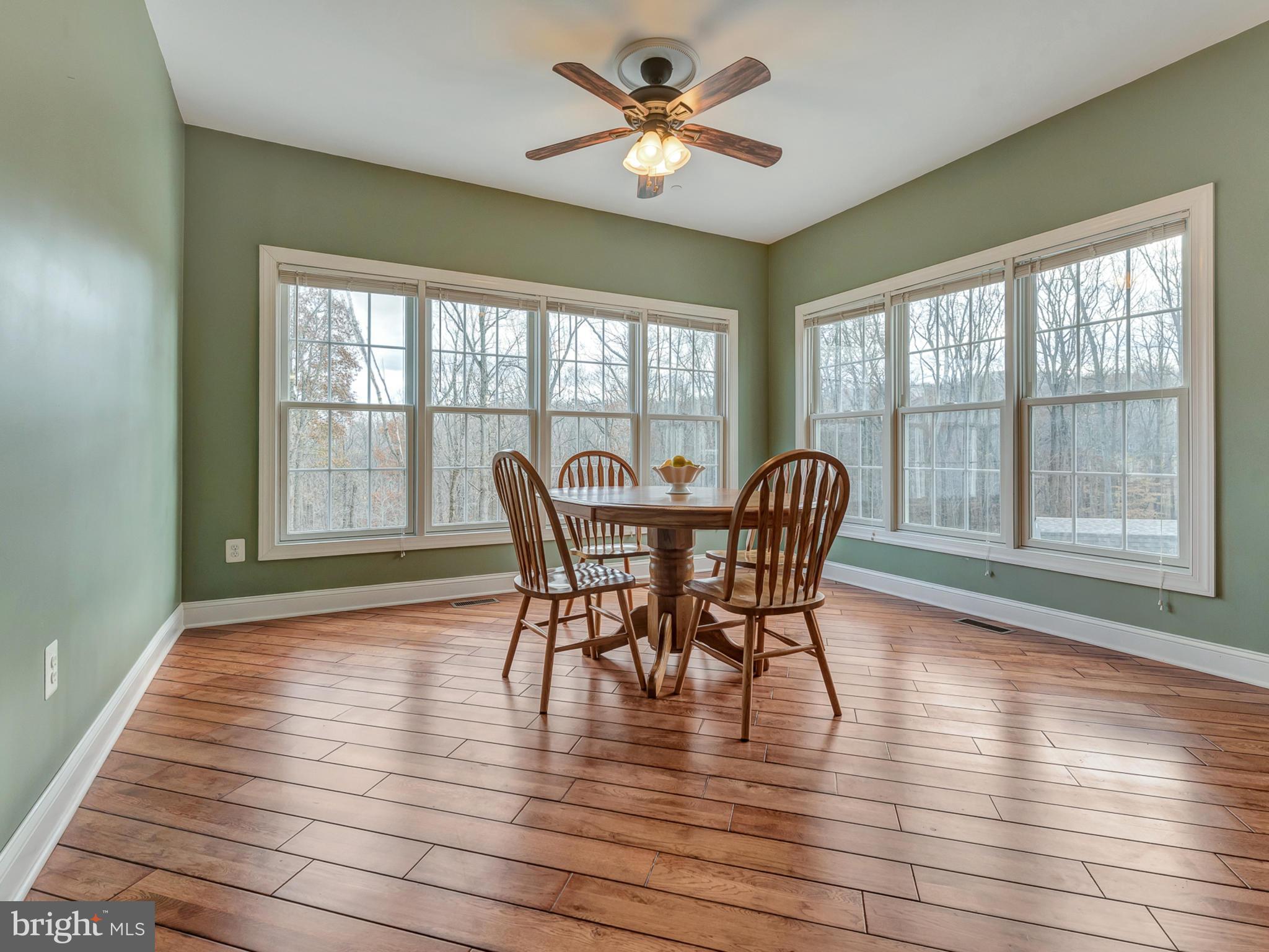 4947 Old Swimming Pool Road Frederick, MD 21703 - Photo 21 of 72 a view of a dining room with furniture window and wooden floor