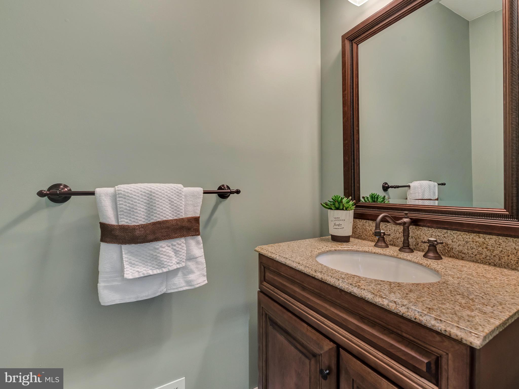 4947 Old Swimming Pool Road Frederick, MD 21703 - Photo 25 of 72 a bathroom with a granite countertop sink and a mirror