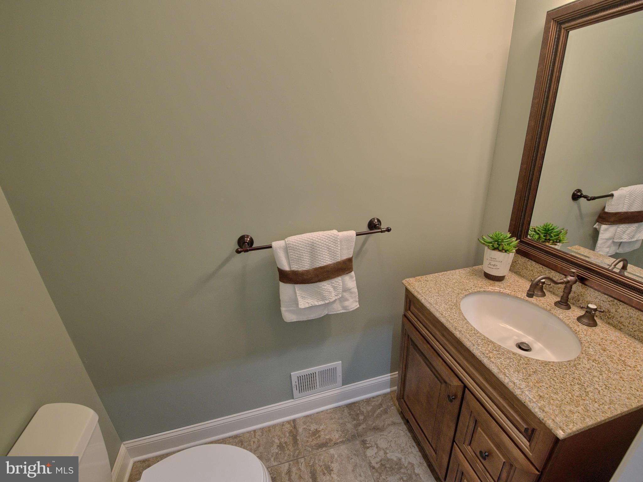 4947 Old Swimming Pool Road Frederick, MD 21703 - Photo 26 of 72 a bathroom with a granite countertop sink and a mirror
