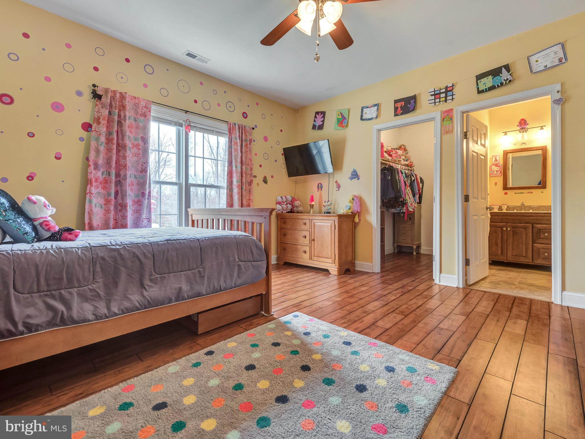 4947 Old Swimming Pool Road Frederick, MD 21703 - Photo 35 of 72 a bedroom with a bed and wooden floor