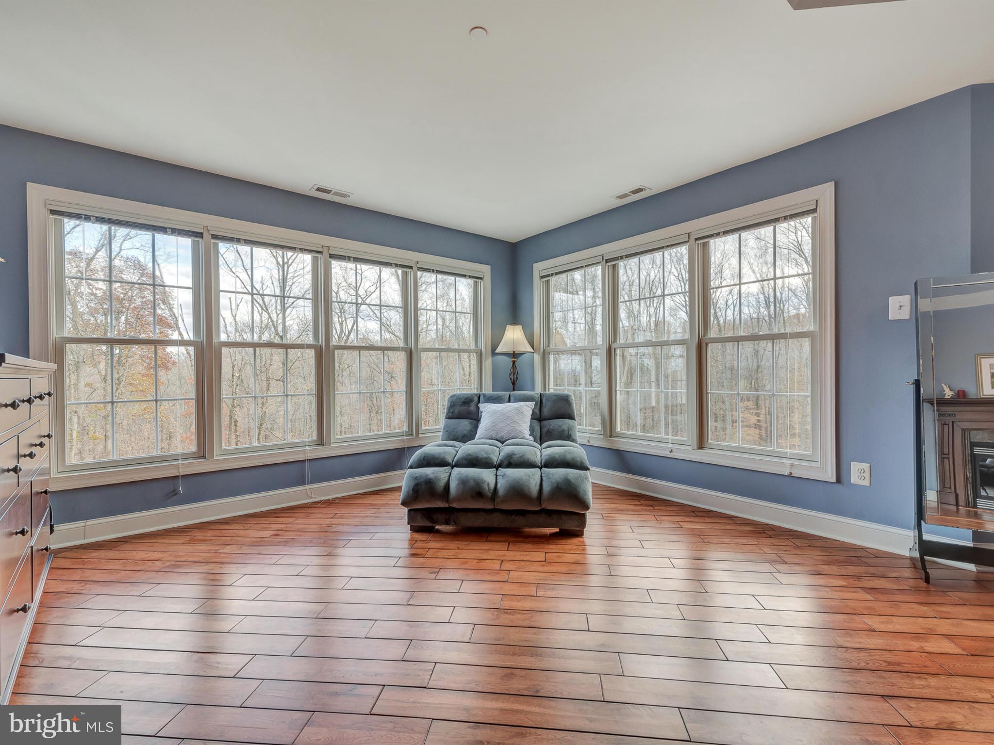 4947 Old Swimming Pool Road Frederick, MD 21703 - Photo 39 of 72 a living room with furniture and floor to ceiling windows