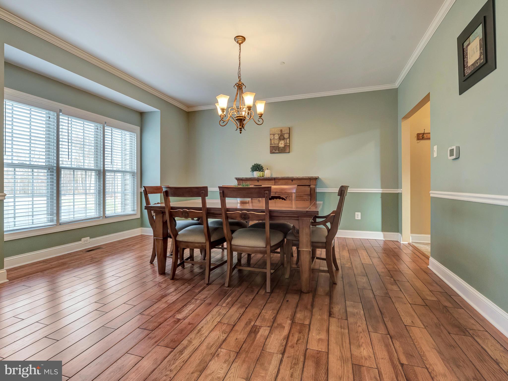 4947 Old Swimming Pool Road Frederick, MD 21703 - Photo 5 of 72 a view of a dining room with furniture window and wooden floor