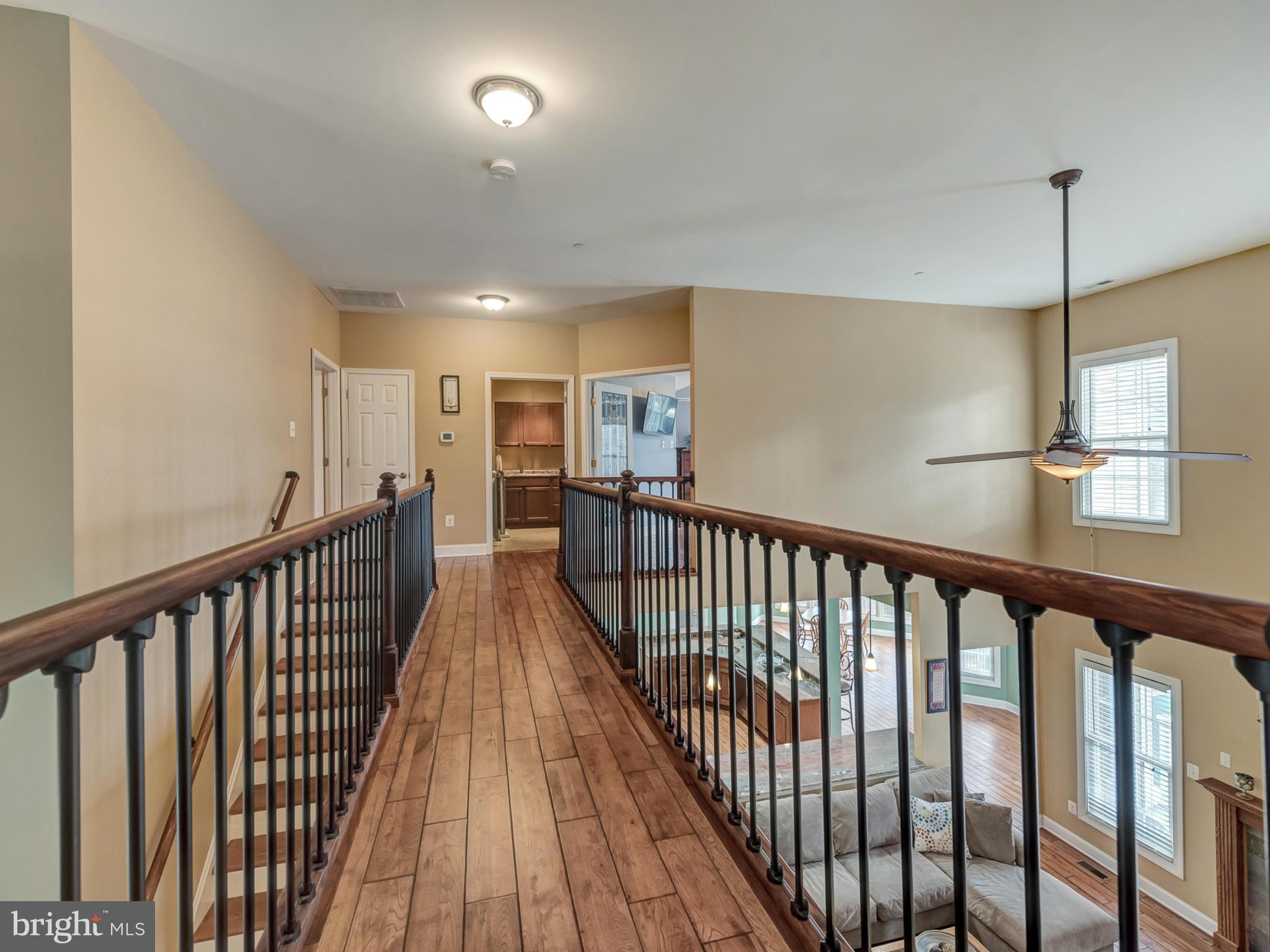 4947 Old Swimming Pool Road Frederick, MD 21703 - Photo 50 of 72 a view of hallway with wooden floor