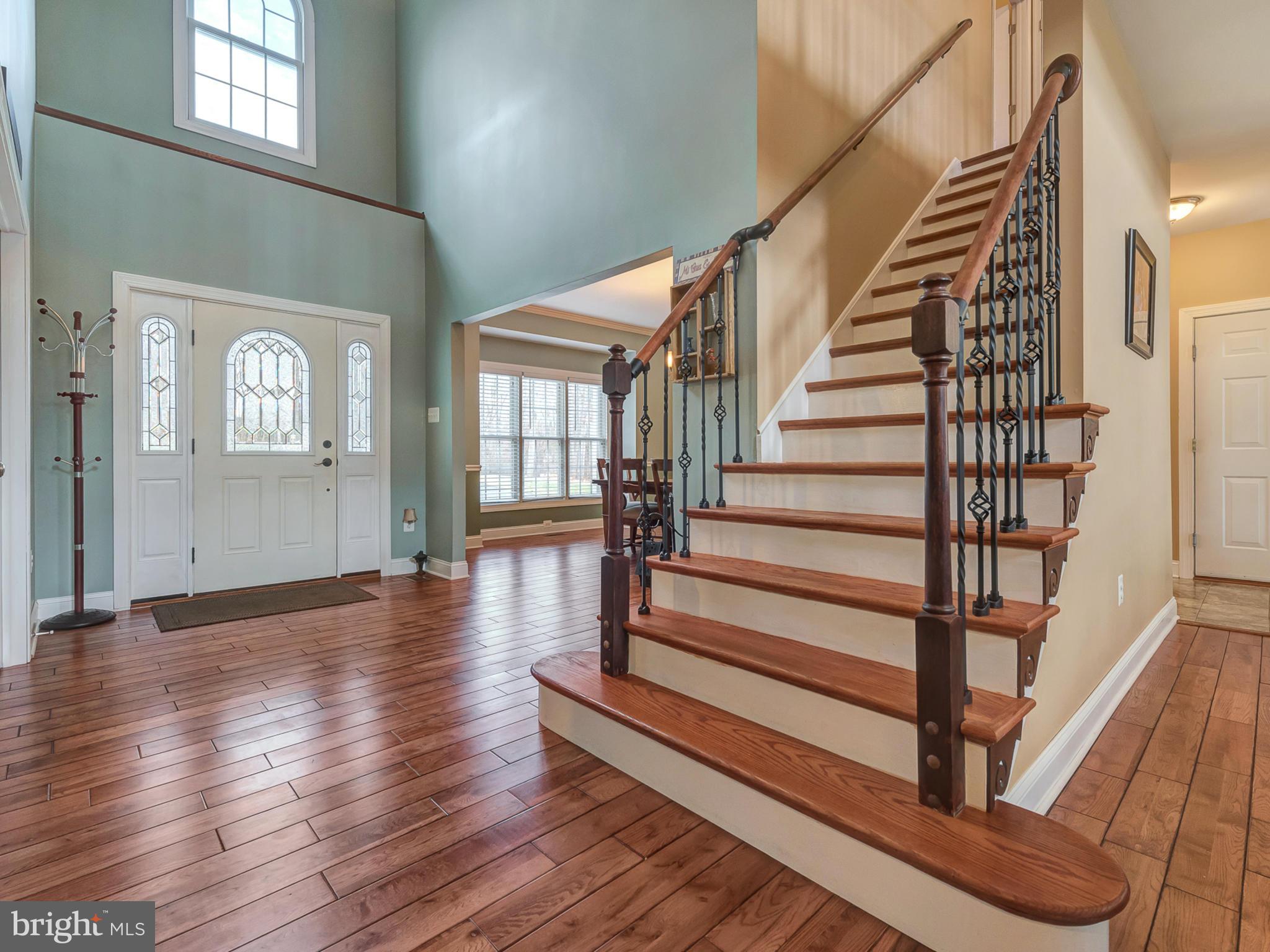 4947 Old Swimming Pool Road Frederick, MD 21703 - Photo 6 of 72 a view of entryway with wooden floor and front door