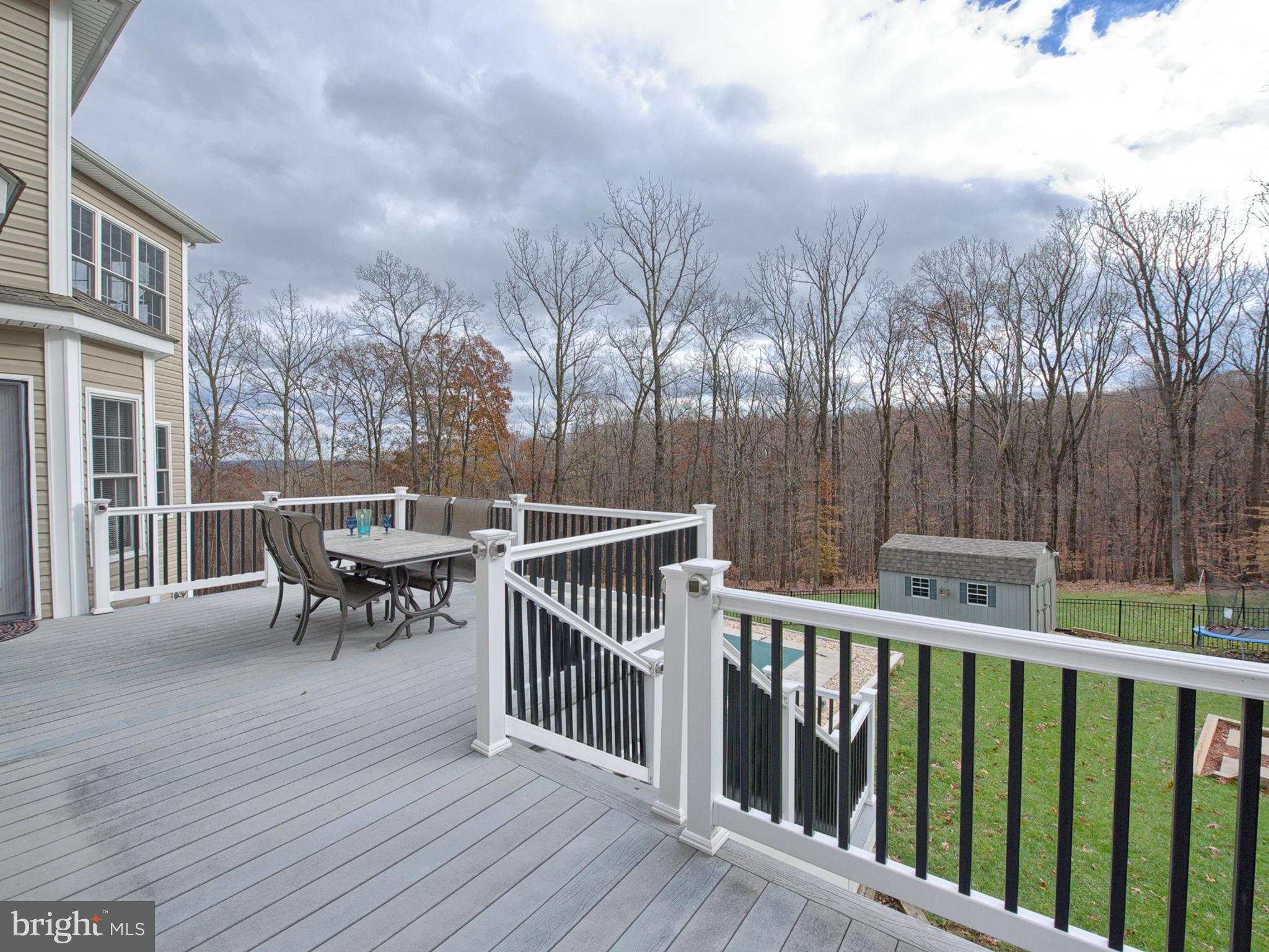 4947 Old Swimming Pool Road Frederick, MD 21703 - Photo 56 of 72 a view of a dinning table and chairs on roof deck