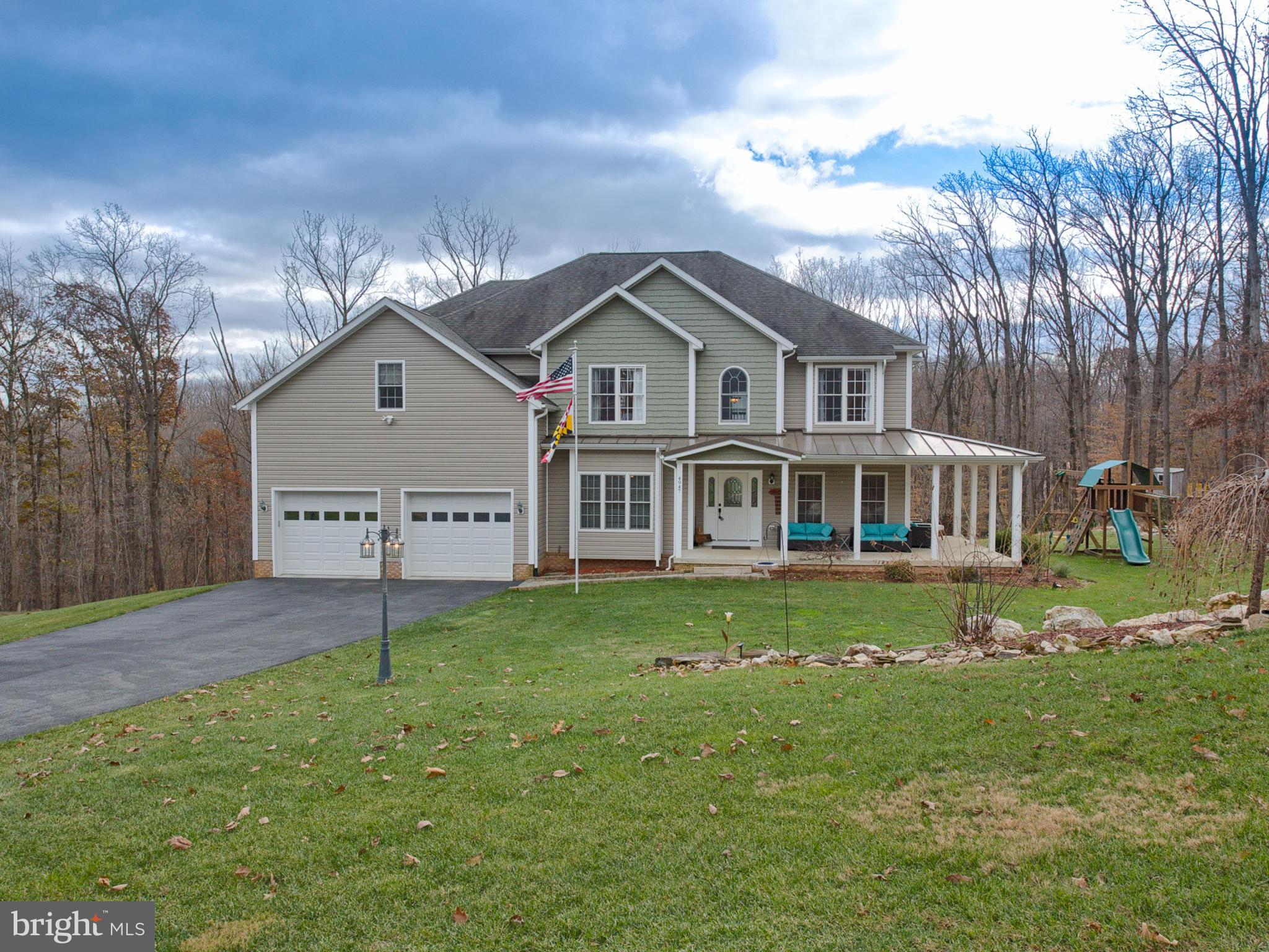 4947 Old Swimming Pool Road Frederick, MD 21703 - Photo 60 of 72 a front view of a house with a garden