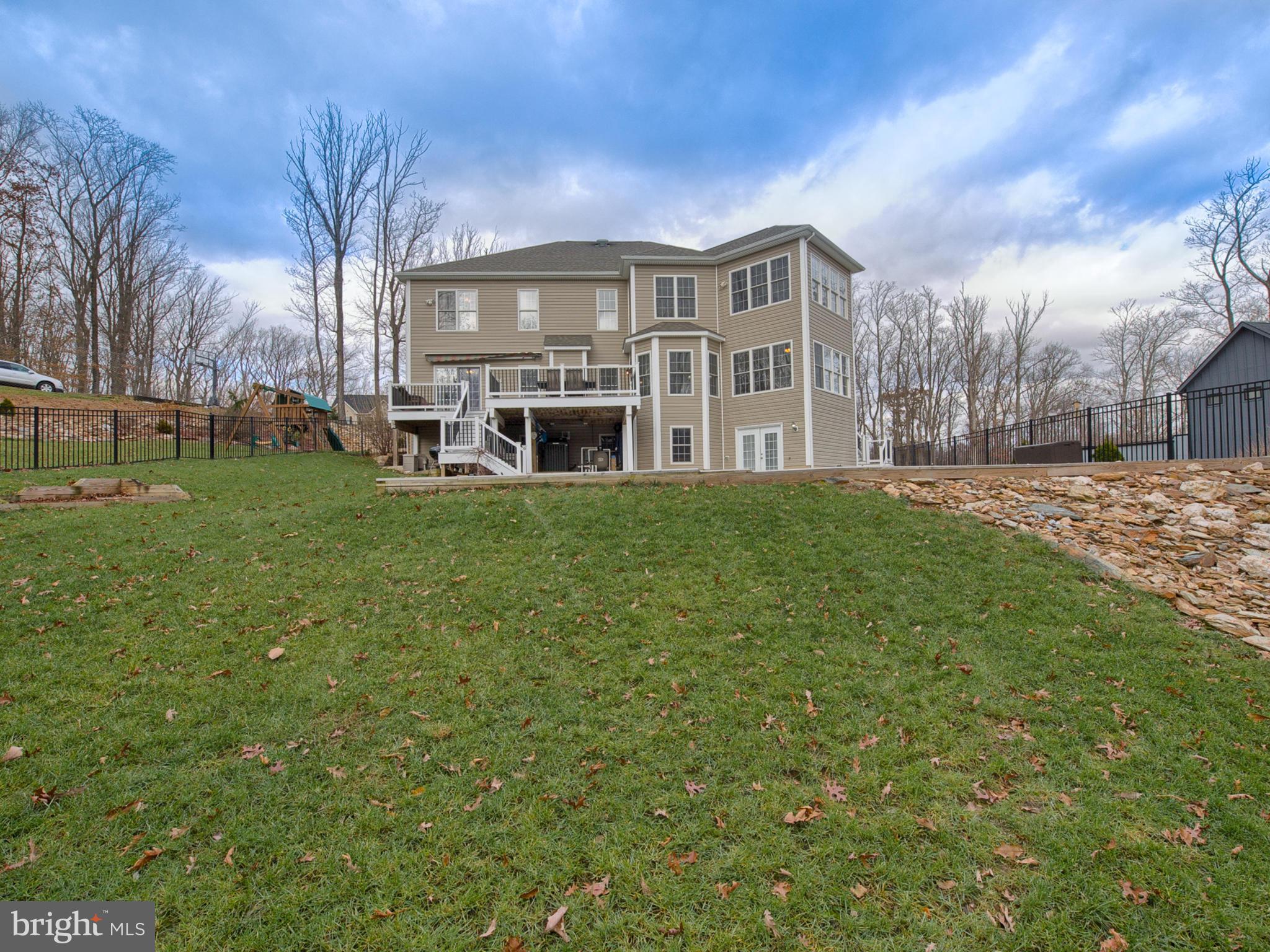4947 Old Swimming Pool Road Frederick, MD 21703 - Photo 65 of 72 a view of a house with a big yard and large trees