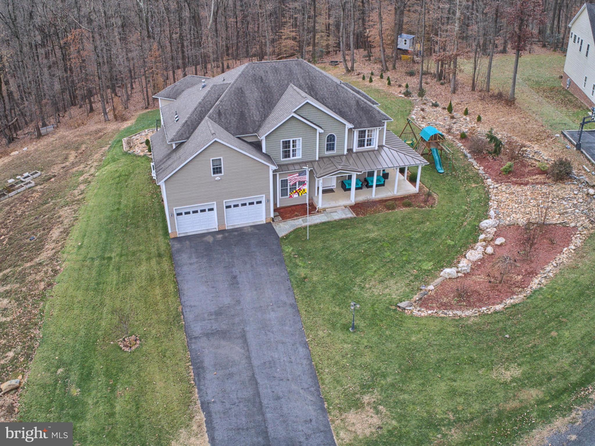 4947 Old Swimming Pool Road Frederick, MD 21703 - Photo 71 of 72 a aerial view of a house next to a big yard and large trees