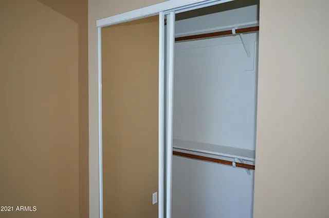 a view of a house with a tree in the background