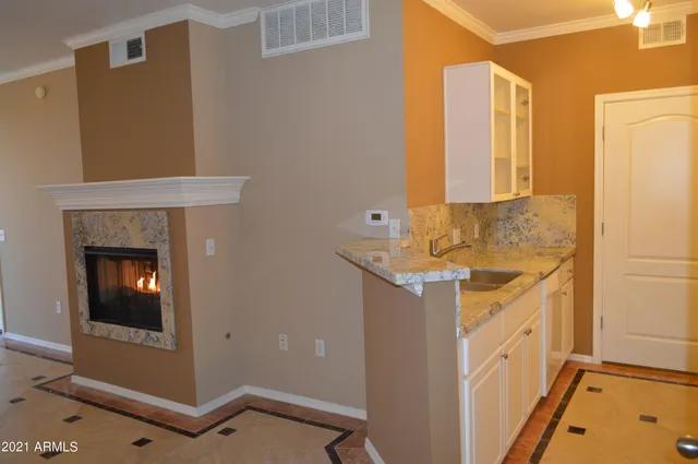 a bathroom with a sink and vanity