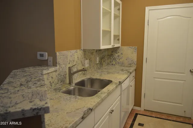 a kitchen with a stove and a refrigerator