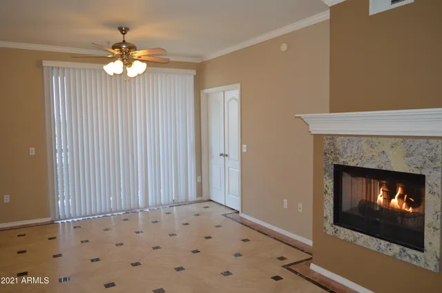 a view of a house with a balcony and wooden floor