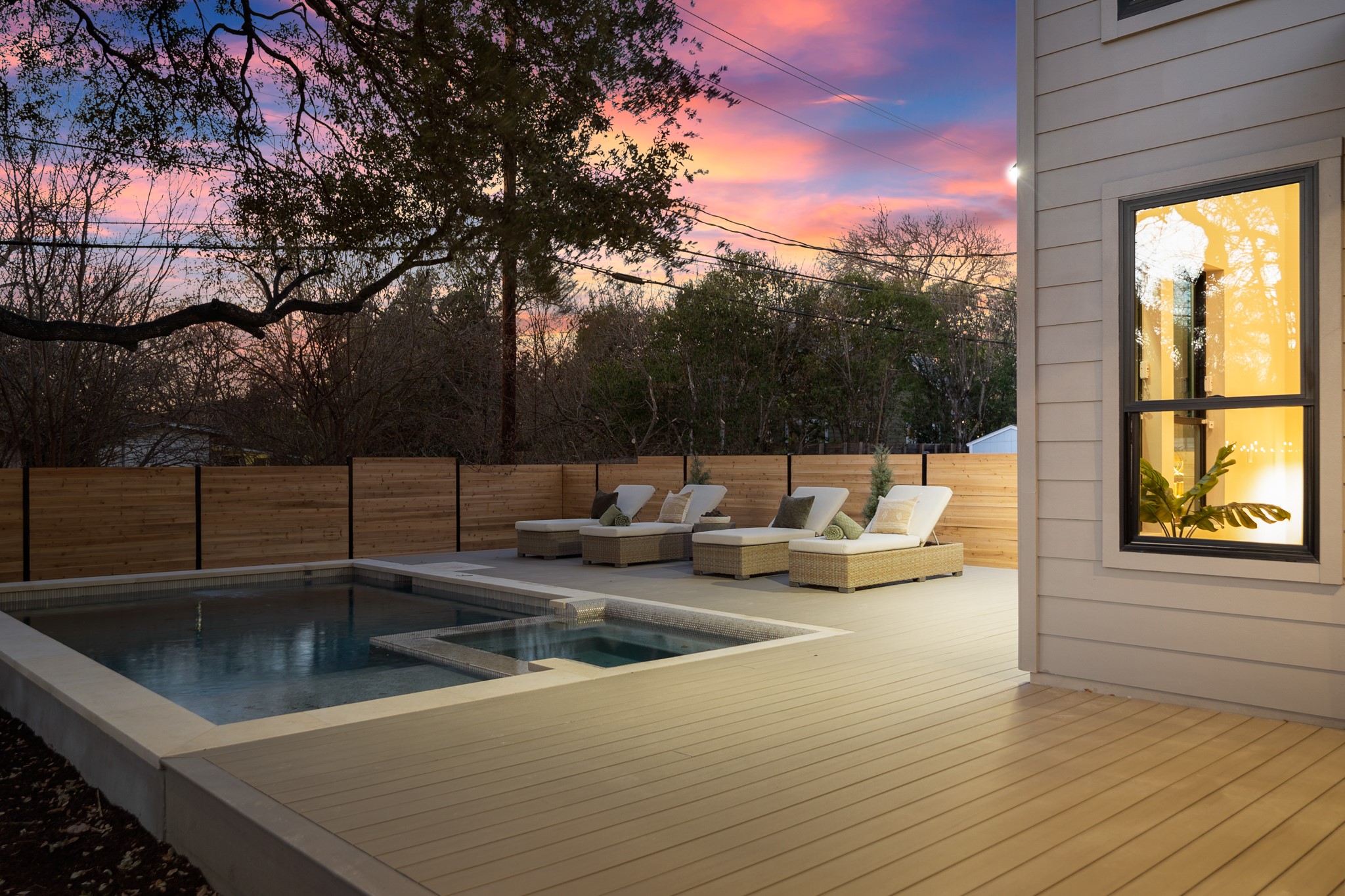 7706 Rutgers Avenue Austin, TX 78757 - Photo 21 of 35 View of swimming pool featuring a fenced backyard, a deck, and a pool with connected hot tub