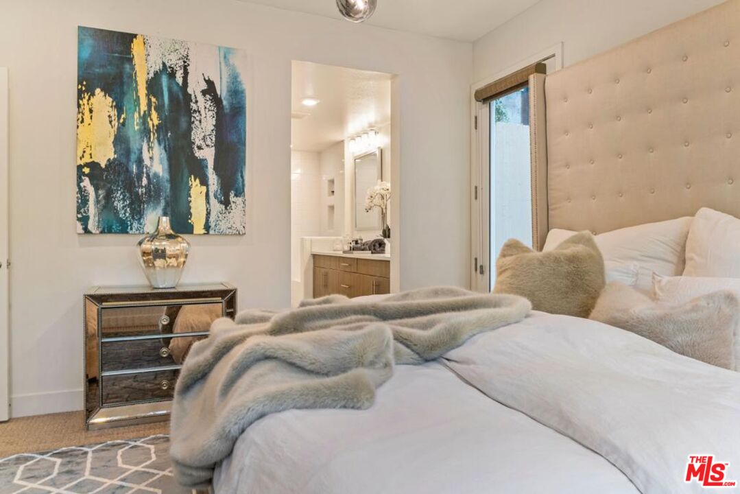 2776 Wright Lane Los Angeles, CA 90068 - Photo 11 of 16 a bedroom with a bed and a mirror