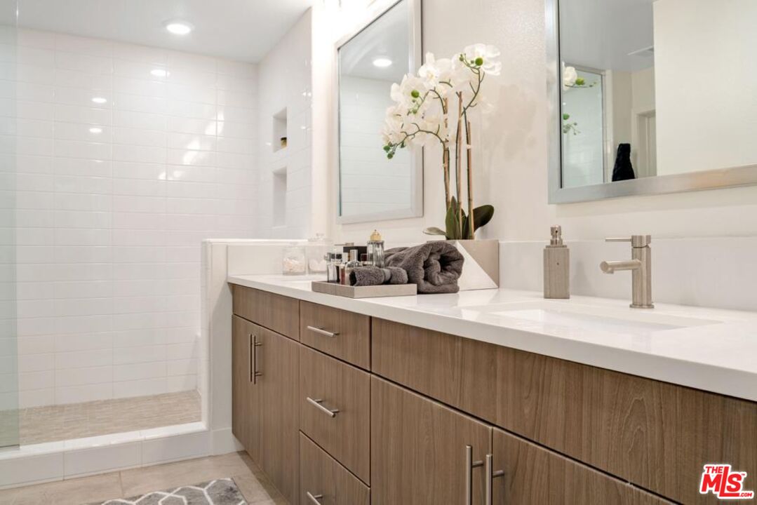2776 Wright Lane Los Angeles, CA 90068 - Photo 12 of 16 a bathroom with a sink vanity and a mirror