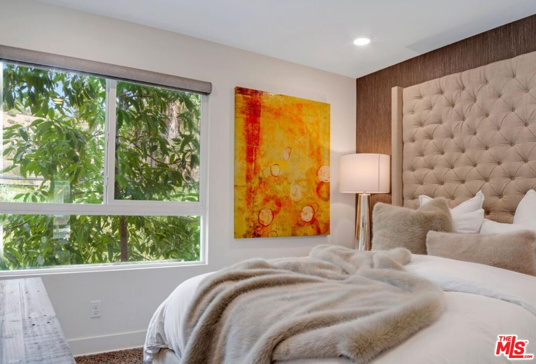 2776 Wright Lane Los Angeles, CA 90068 - Photo 13 of 16 a bedroom with a bed and a painting on the wall