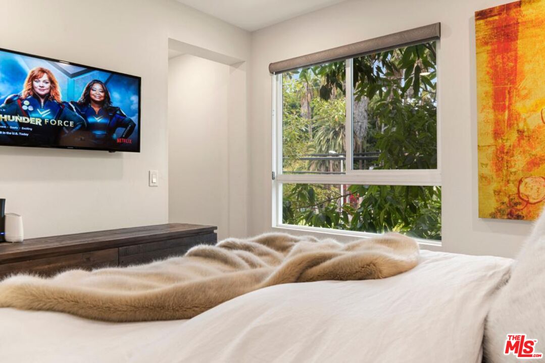 2776 Wright Lane Los Angeles, CA 90068 - Photo 14 of 16 a bedroom with a bed and a painting on the wall