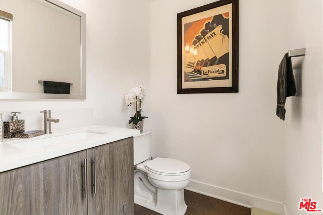 2776 Wright Lane Los Angeles, CA 90068 - Photo 15 of 16 a bathroom with a toilet a sink and mirror
