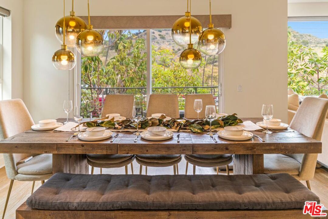 2776 Wright Lane Los Angeles, CA 90068 - Photo 7 of 16 a view of a dining room with furniture wooden floor and chandelier