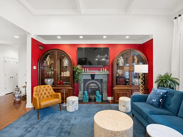 a living room with furniture and a fireplace