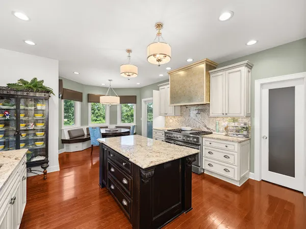a kitchen with a stove a sink and a refrigerator