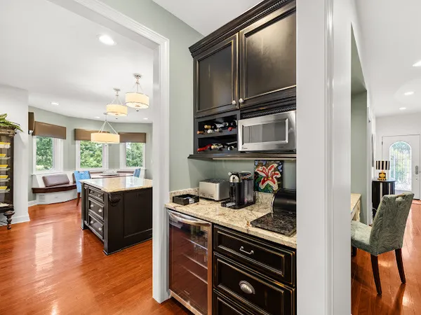 a kitchen with stainless steel appliances granite countertop a stove and a microwave