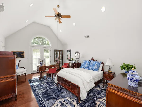 a bathroom with a sink mirror vanity and toilet