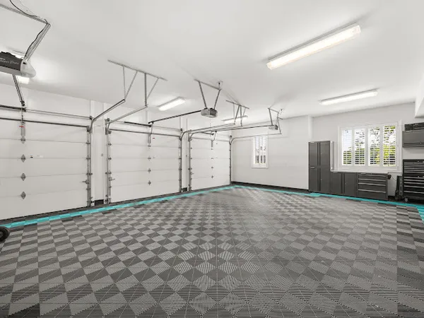 a view of a big house with a big yard and large trees