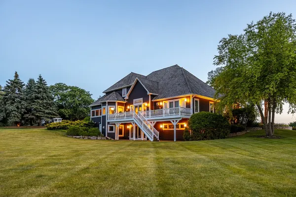 an aerial view of a house with yard swimming pool and outdoor seating