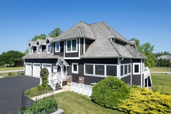 a view of a balcony with chairs