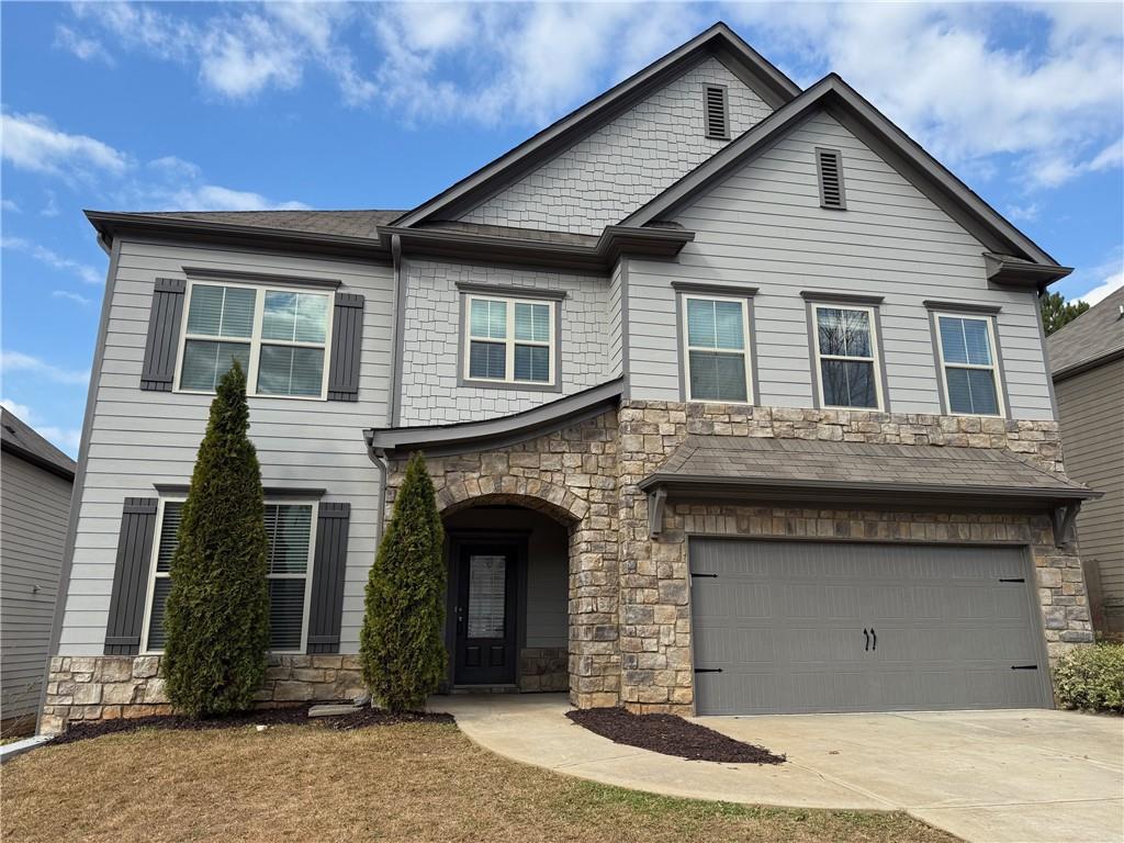 a front view of a house with yard