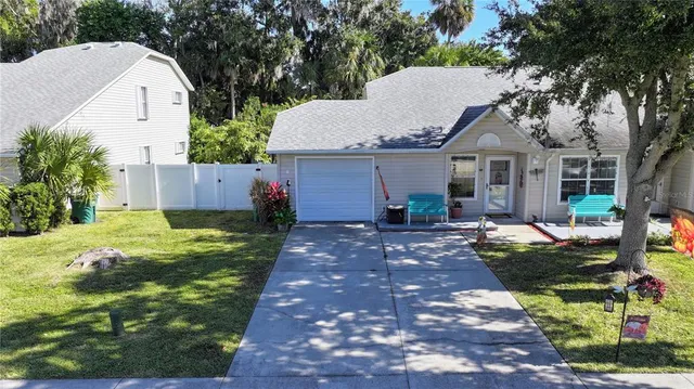 a kitchen with stainless steel appliances granite countertop a refrigerator sink and white cabinets