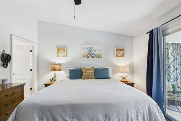 a bathroom with a granite countertop sink toilet and mirror