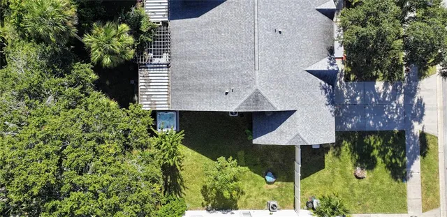 a living room with furniture dining table and a chandelier