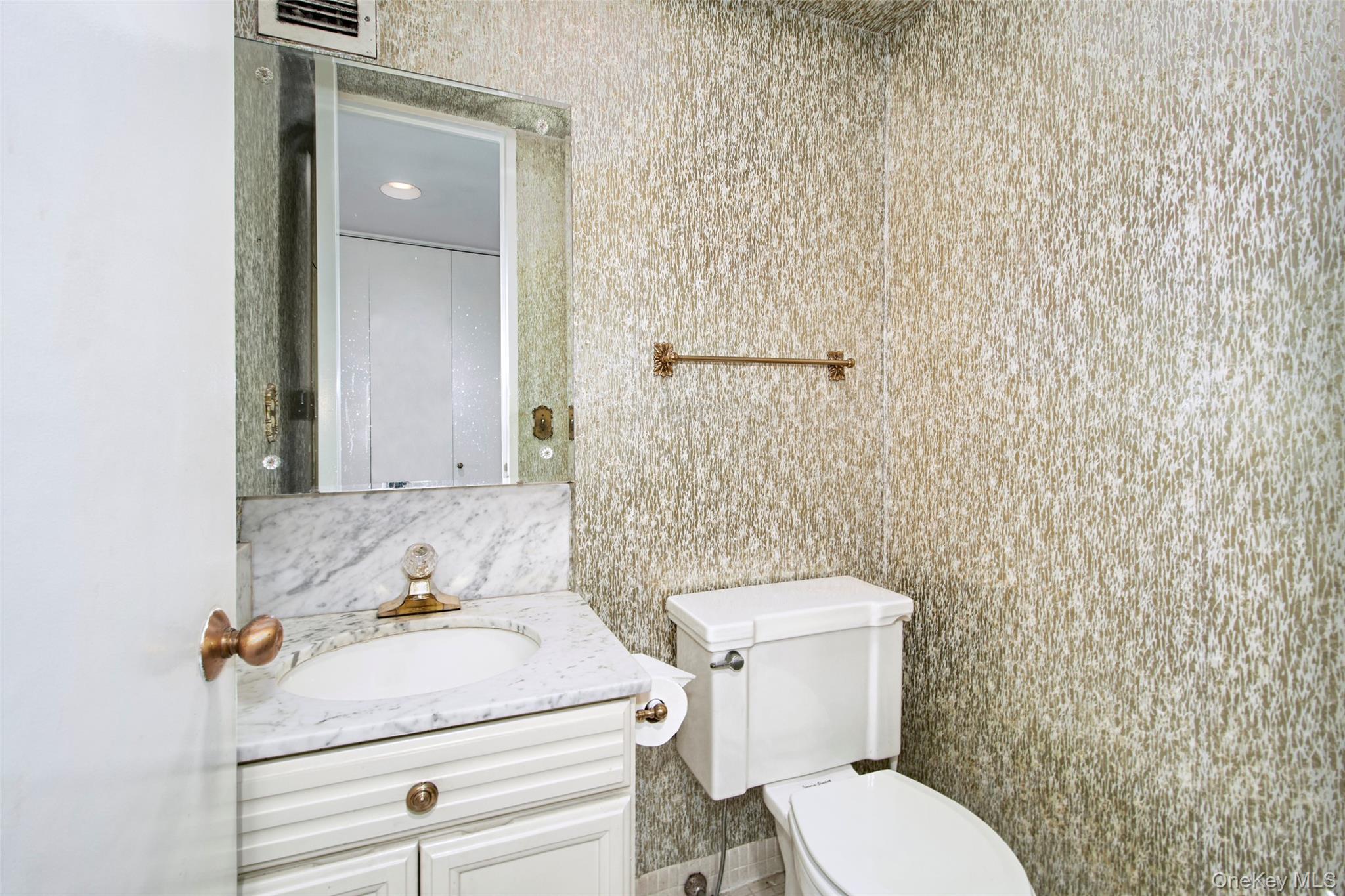 720 Milton Road, Unit 4C WEST Rye, NY 10580 - Photo 11 of 21 a bathroom with a sink and a toilet